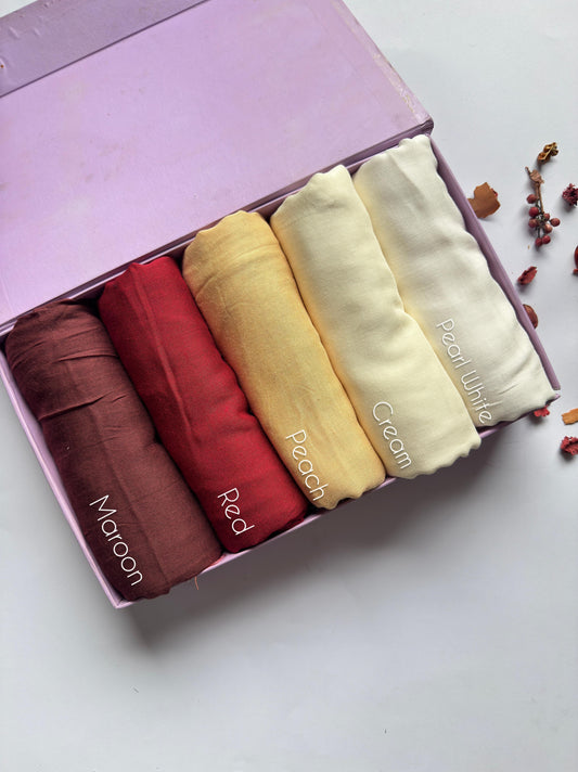 Aynn Alif Plain Modal Lawn Hijab Collection featuring Maroon, Red, Peach, Cream and Pearl White shades in extra-large breathable fabric.