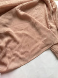 Powder Pink Bubble Pleated Lawn Hijab with slight stain, soft breathable lawn fabric and elegant pleated texture offered at a discounted price.