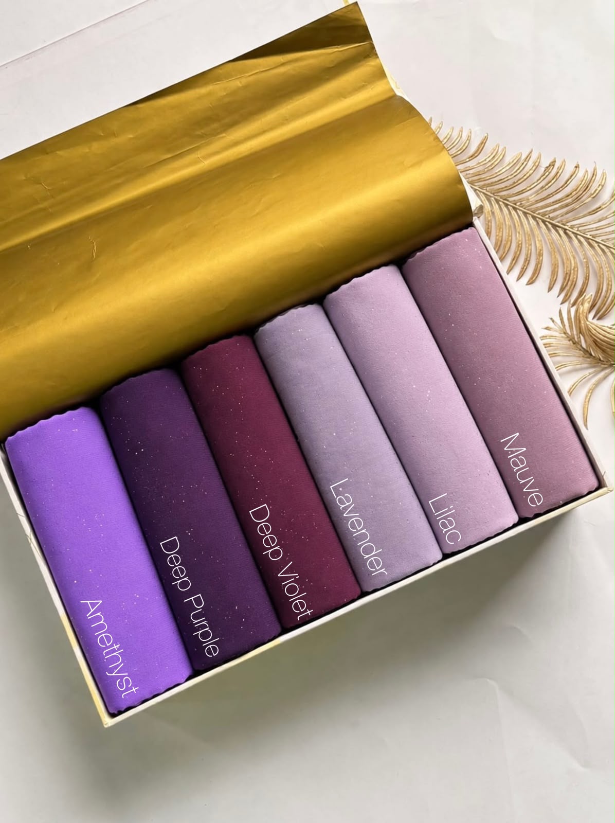 Aynn Alif glitter chiffon georgette hijab collection featuring Amethyst, Deep Purple, Deep Violet, Lavender, Lilac and Mauve shades in Pakistan.