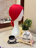 Red plain tie-back hijab underscarf cap in soft stretch fabric displayed on white mannequin side profile