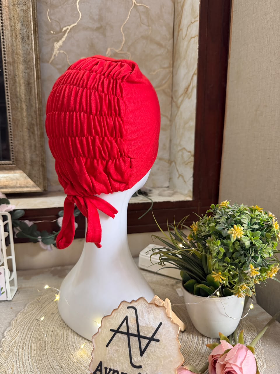 Red ruched tie back hijab cap made from soft breathable jersey with full head coverage and adjustable tie-back by Aynn Alif.