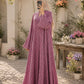 Pink printed front open abaya in Korean Nidah with a double-flare silhouette, styled with a neutral hijab in a flower-filled courtyard.
