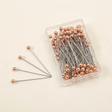 Rose gold hijab pins box of 100 by Aynn Alif Pakistan featuring premium rose gold scarf pins for elegant hijab wear.