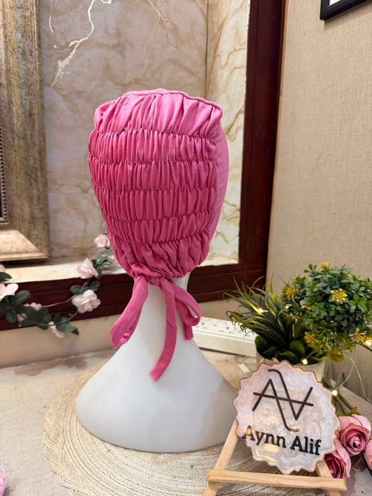 Rose Pink ruched tie back hijab cap made from soft breathable jersey with full head coverage and adjustable tie-back by Aynn Alif.