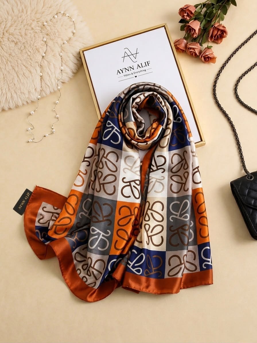 Rust orange, navy and ivory printed silk scarf with abstract signature-style pattern by Aynn Alif