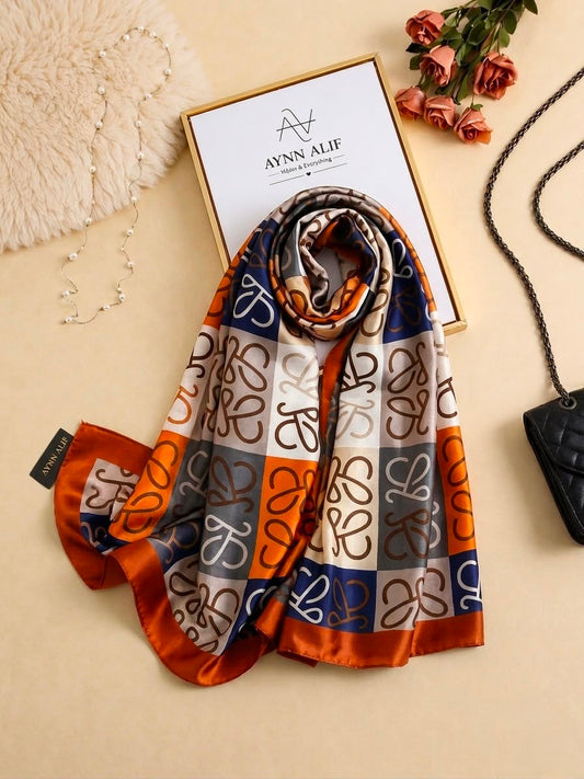 Rust orange, navy and ivory printed silk scarf with abstract signature-style pattern by Aynn Alif