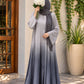 Silver-grey to charcoal ombre front open abaya in Silk Korean Nidah with straight sleeves and matching scarf, styled in an elegant outdoor setting.