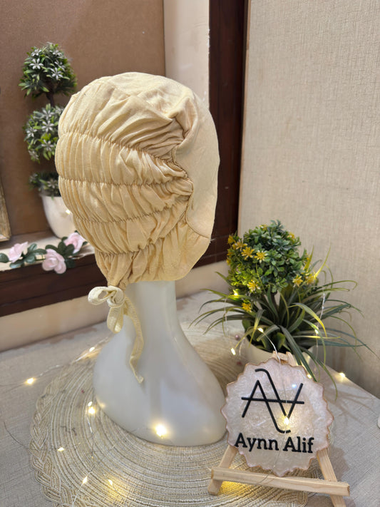 Skin ruched tie back hijab cap made from soft breathable jersey with full head coverage and adjustable tie-back by Aynn Alif.