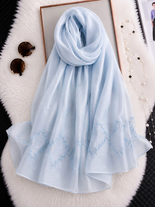Sky blue cotton silk hijab with embroidered organza border and delicate embroidery.