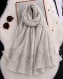 Steel grey cotton silk hijab with embroidered organza border and pearl detailing.