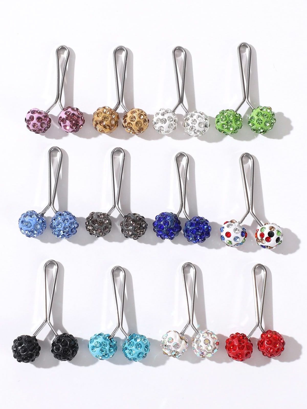 Stones studded loop pin for hijab styling featuring sparkling crystal accents and smooth silver glider design, secure snag-free scarf accessory.