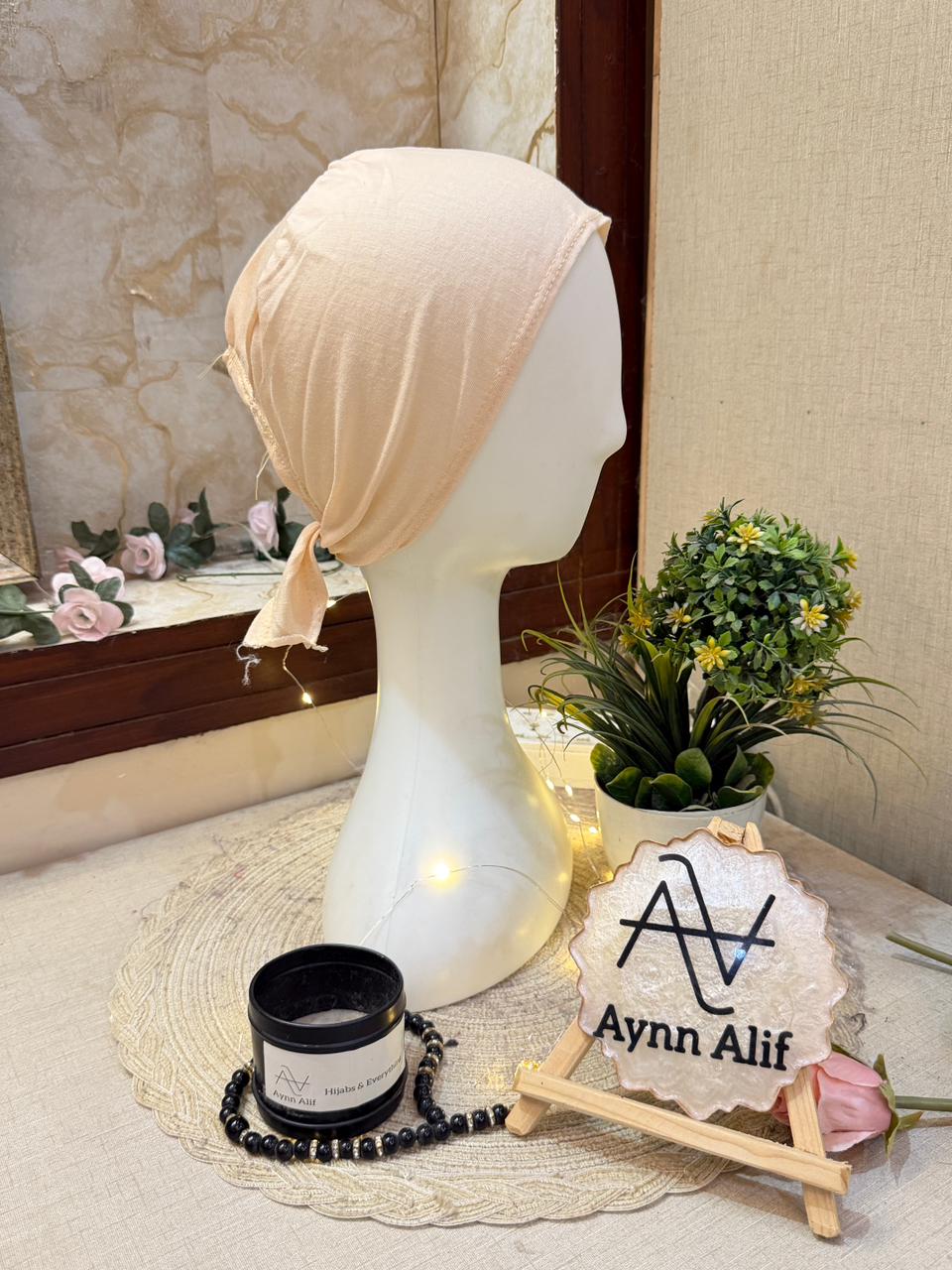 Vanilla plain tie-back hijab underscarf cap tied at back displayed on white mannequin