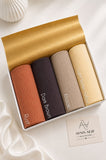 Aynn Alif large ribbed jersey hijabs in Rust, Dark Brown, Khaaki and Light Butter Yellow, arranged in a white presentation box.