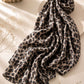 Extra large leopard print modal lawn hijab in beige, mocha brown and black tones with soft breathable fabric and double-sewn edges