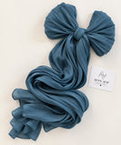 
Zinc blue stones-studded matte silk hijab with a soft, flowy drape and delicate stone embellishments by Aynn Alif.