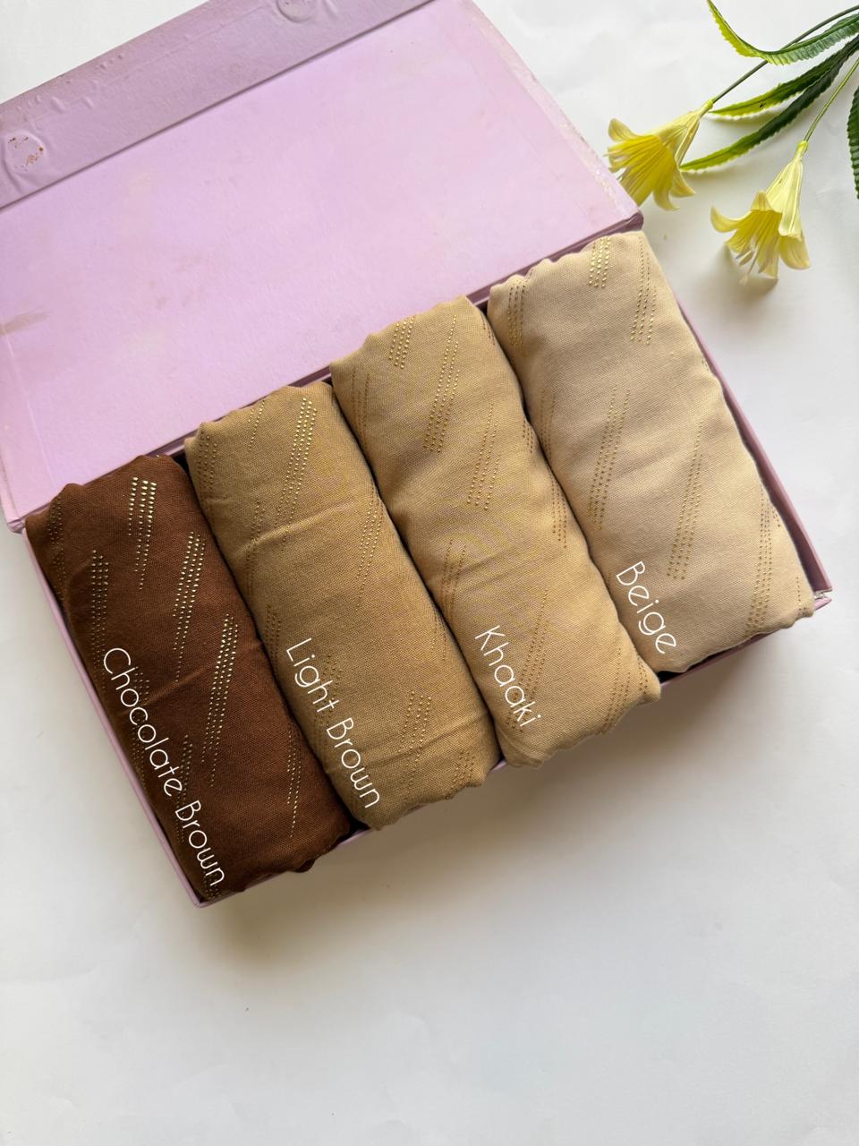 Neutral tone lawn hijabs set in chocolate brown, light brown, khaki and beige with golden embossed dot pattern in box packaging