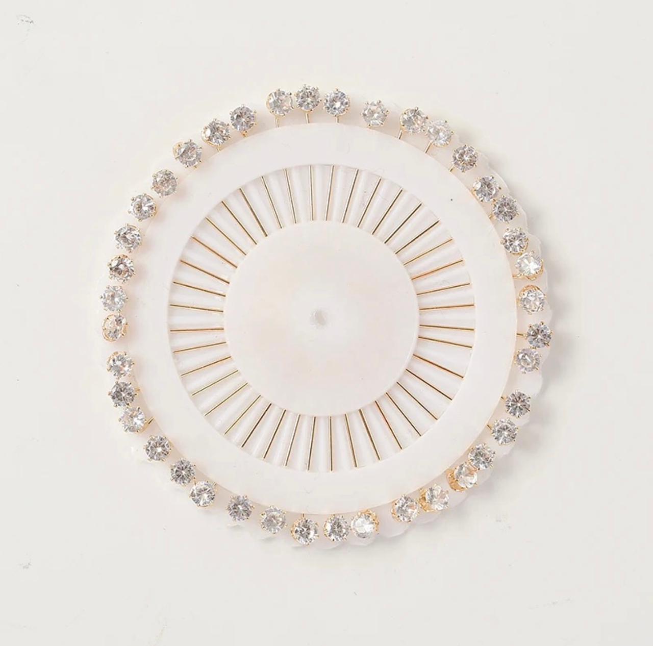 
White stone studded pinwheel hijab pins with 30 embellished scarf pins for elegant hijab styling.
