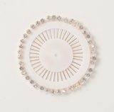
White stone studded pinwheel hijab pins with 30 embellished scarf pins for elegant hijab styling.